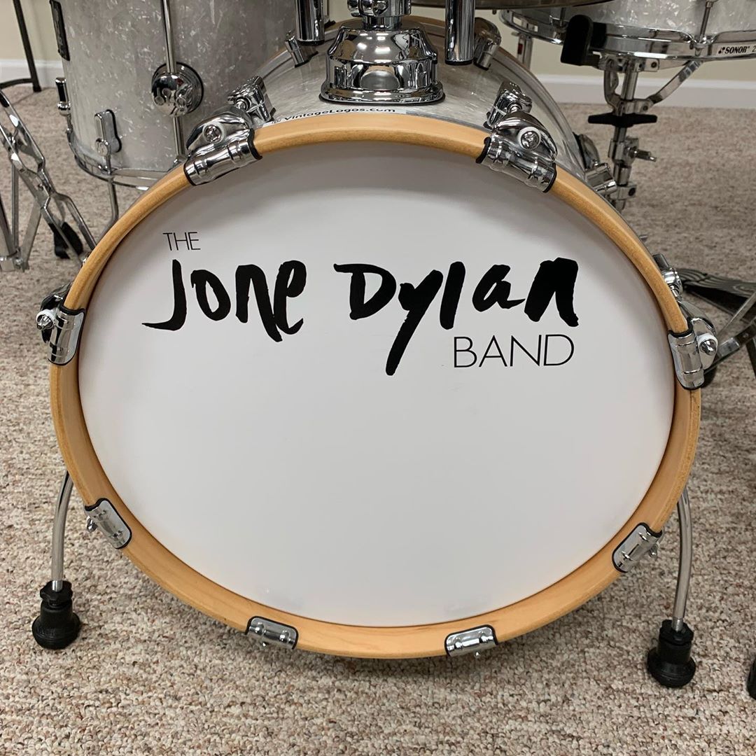 A bass drum with The Jone Dylan Band logo on it.